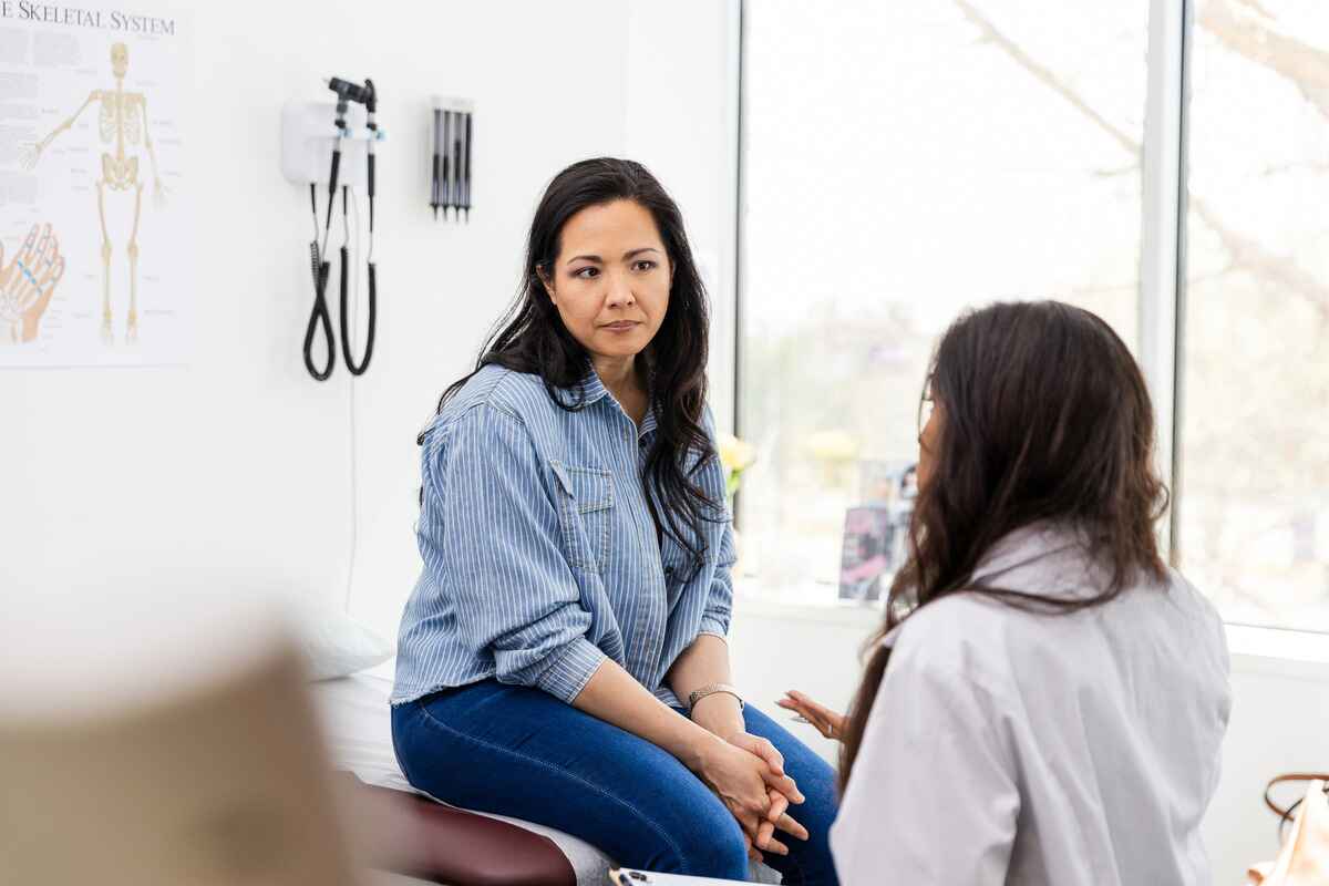 Doctor talks to female patient about depression