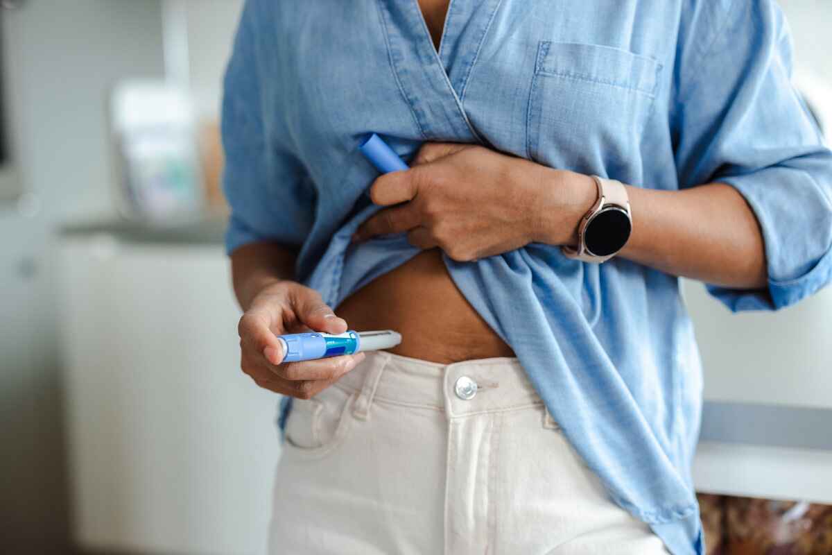 Woman takes GLP-1 for weight loss