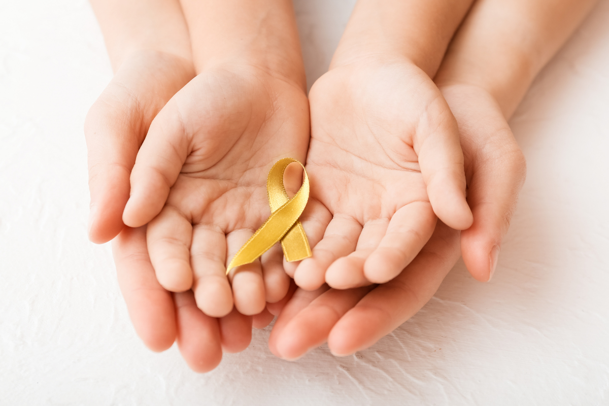 gold ribbon representing childhood cancer awareness
