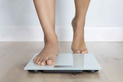 Feet stepping on scale