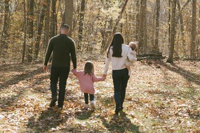 a family walking in the woods