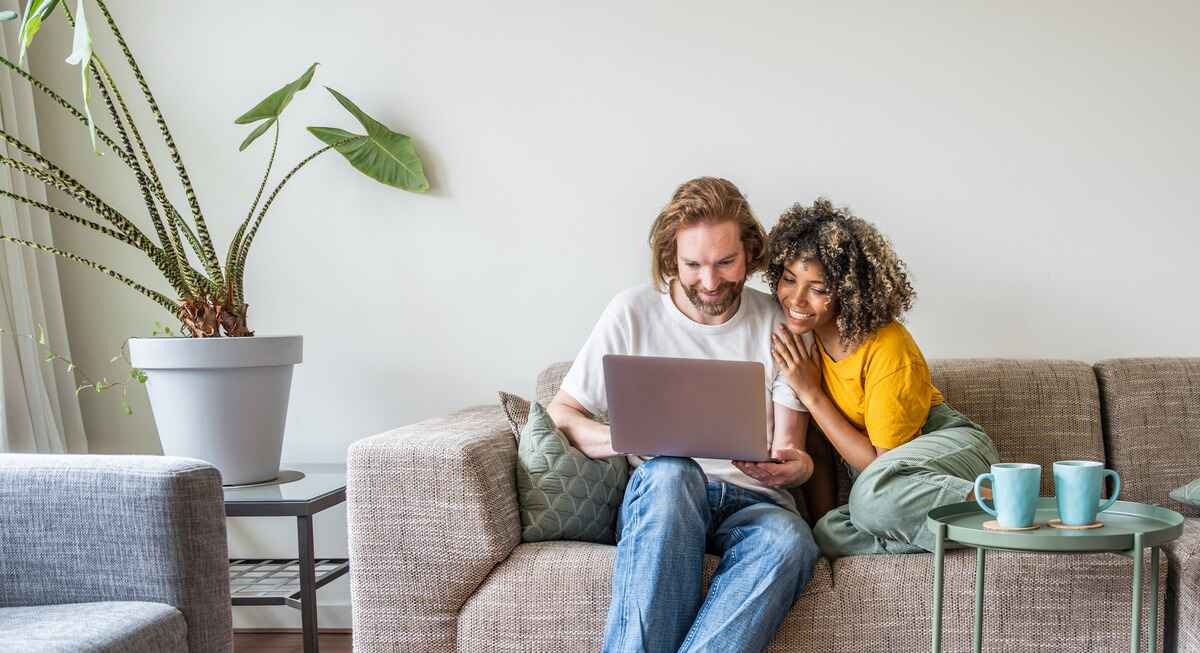 couple sits on the couch together