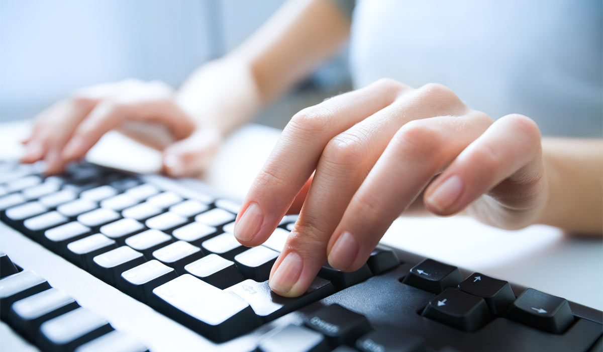 Hands on a computer keyboard