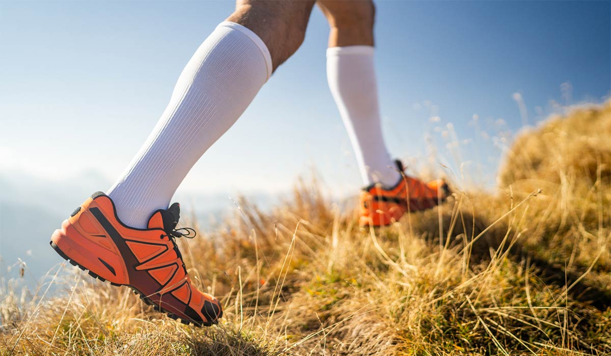 Person running up a mountain