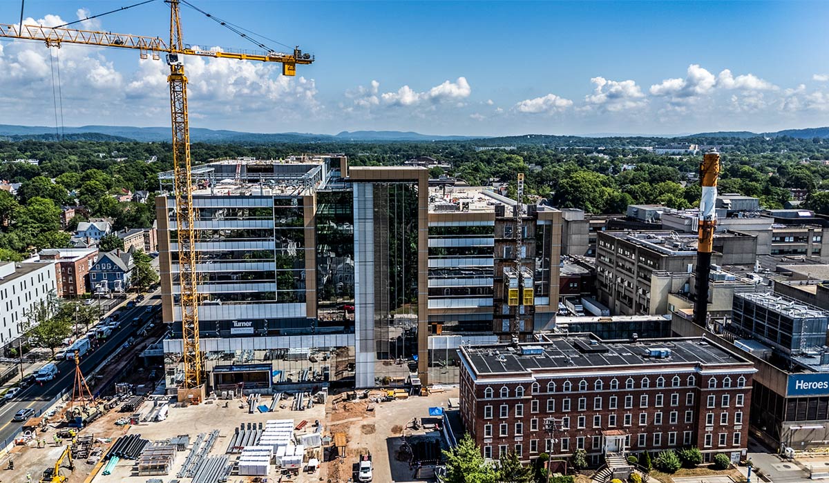 Adams Neurosciences Center, with the red-brick Selina Lewis building in the foreground, lower right.
