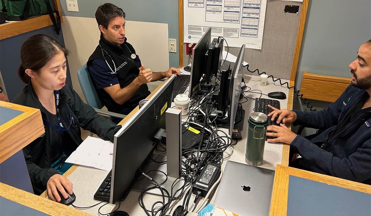 Guido Falcone, MD, ScD (center)