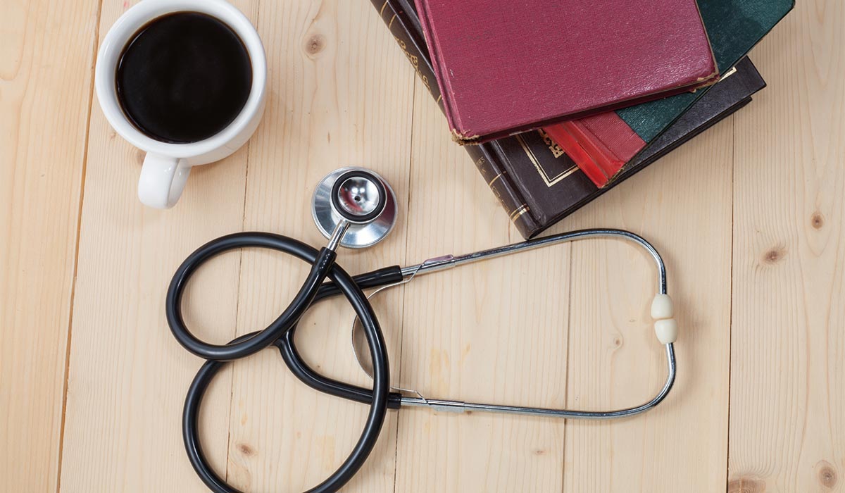 stethoscope, books, coffee