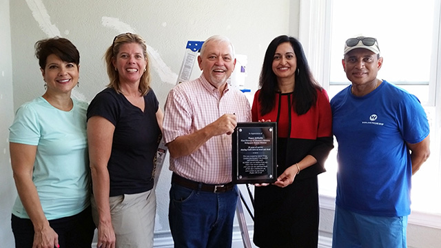 YPresident & CEO Dr. Prathibha Varkey, Northeast Medical Group receiving plaque from Reverand Terry Wilcox, Bridgeport Rescue Mission 